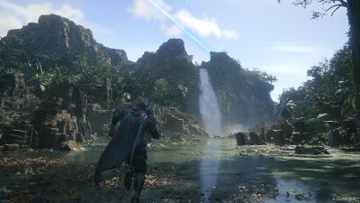 A screenshot showing Clive walking through a watery area. A mountain in the background has a waterfall pouring off of it, and a blue beam of light firing into the sky.